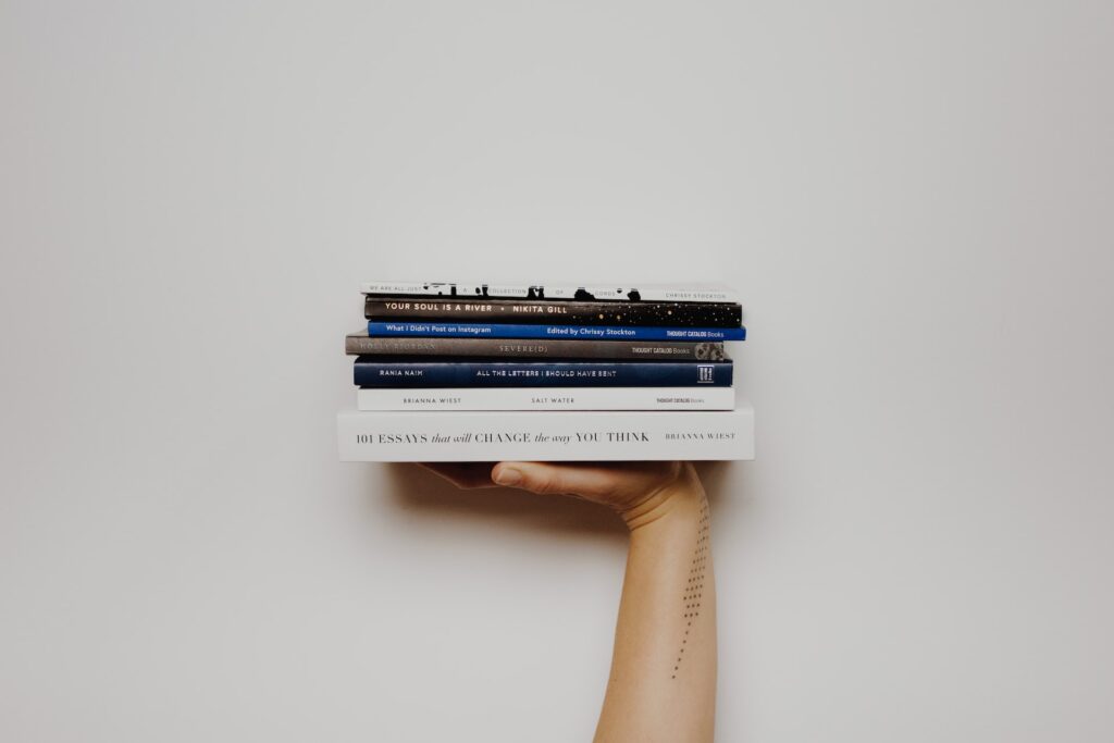Books in hand - Photo by Thought Catalog on Unsplash