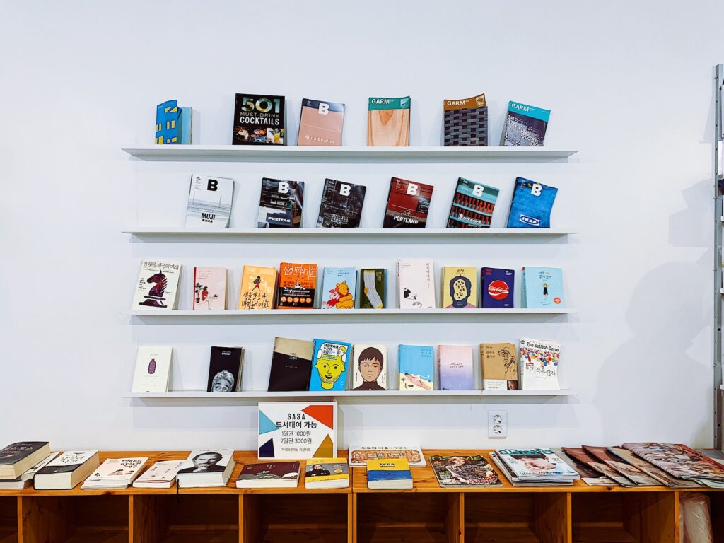 Publishing books displayed on stand - Photo by Y J Lee for Unsplash