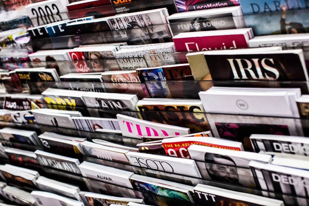 Magazines on racks - Photo by Charisse Kenion on Unsplash