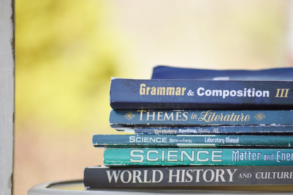Pile of academics books - Photo by Clarissa Watson on Unsplash

