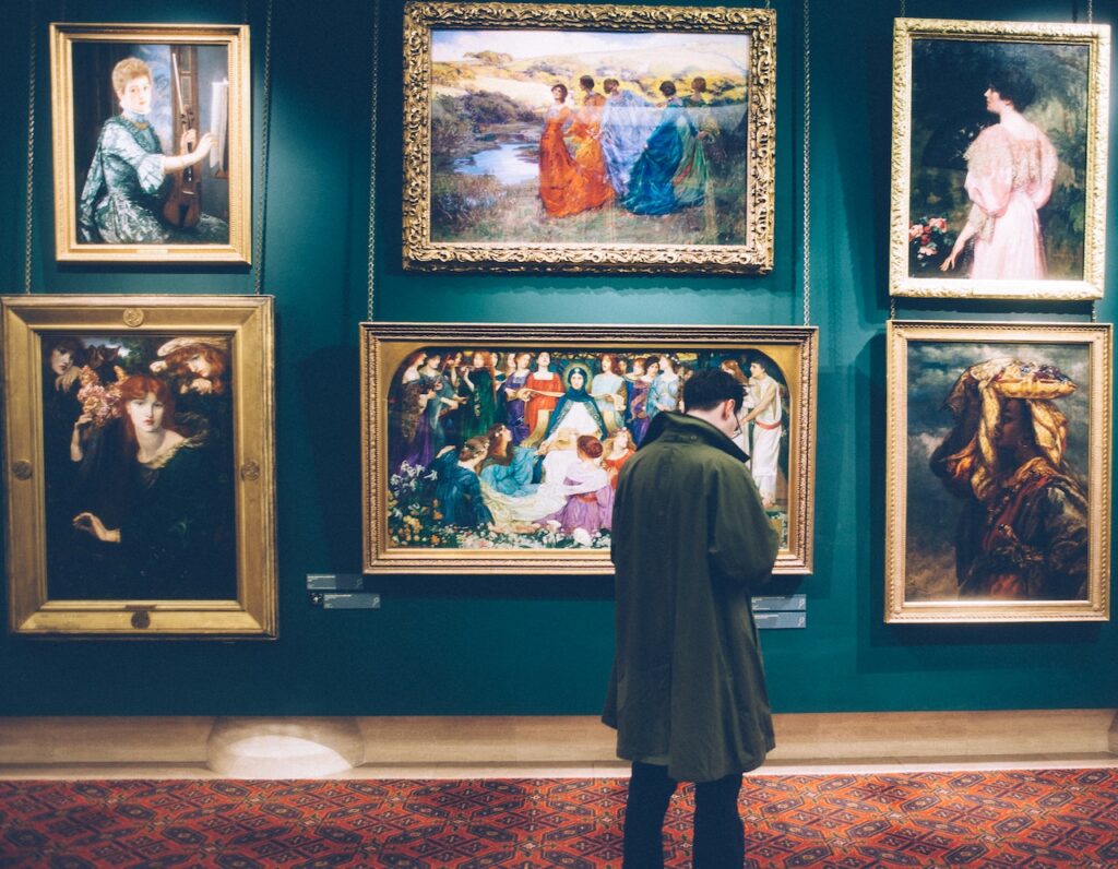 Man in art gallery - Photo by Clem Onojeghuo for pexels