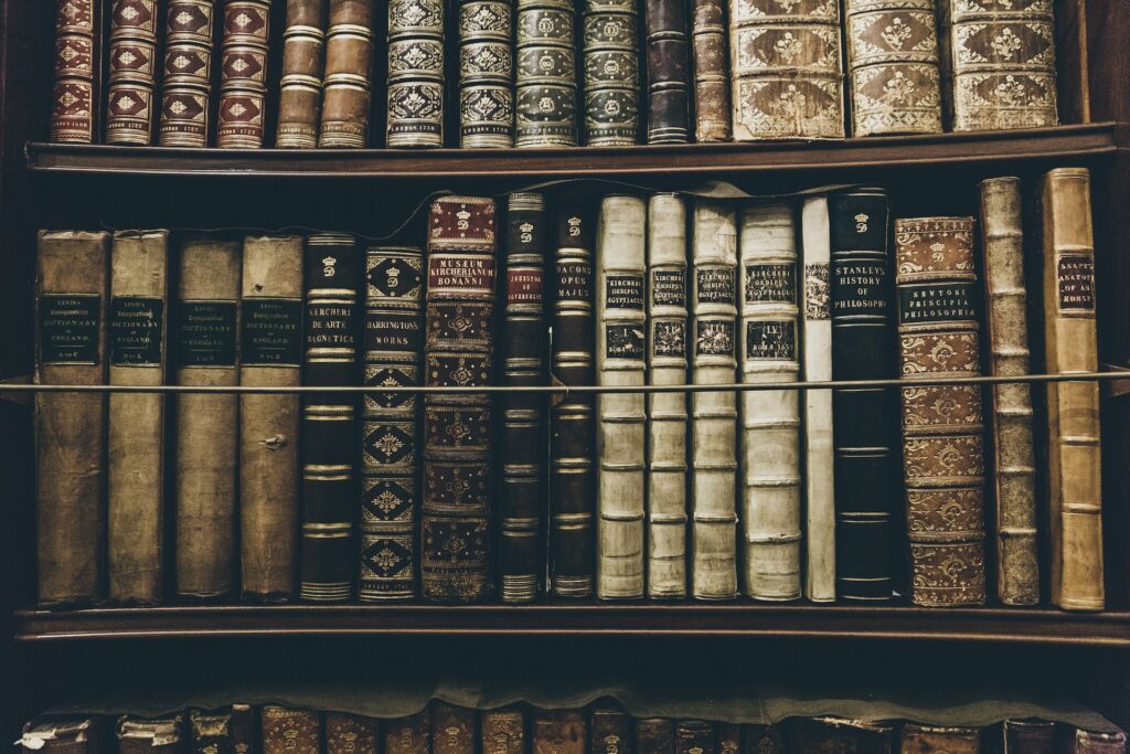 Research books at a library - Photo by Thomas Kelley on Unsplash