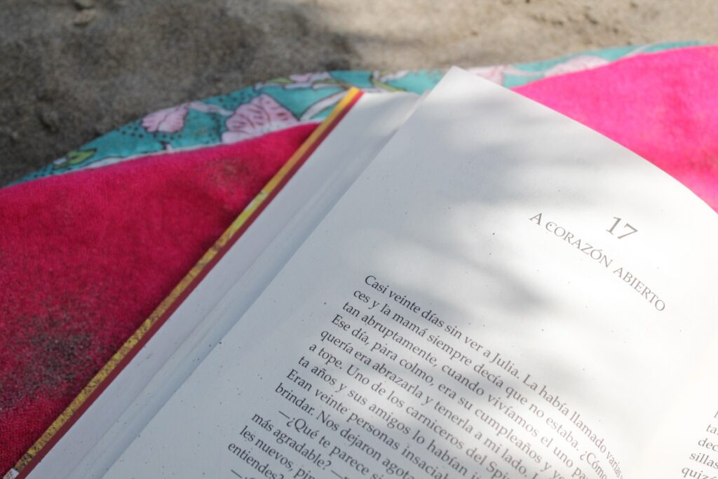 Reading on the beach - Photo by Jastine Camacho for Unsplash